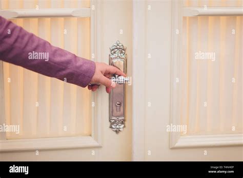 man hand holding door element handle  open  lock  door stock