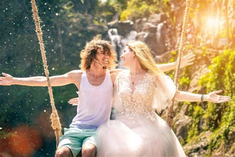 Beautiful Couple Together On Swings At Sunset Stock Image Image Of Beautiful Flare 75956705