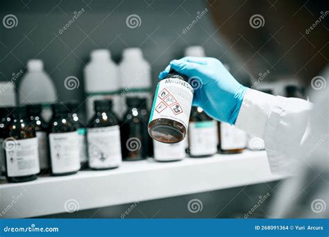 Chemical Magnesium Solution And Chemistry Worker Hands In A Laboratory