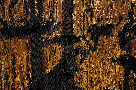 Reversible iridescent sequin fabric. Black and gold abstract glitter ...