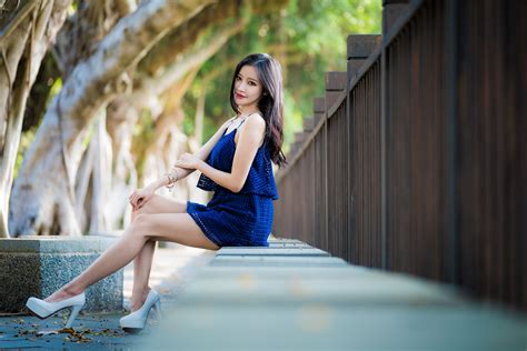 4k Asian Bokeh Sitting Legs Shorts Brown Haired Glance Stilettos Fence Hd Wallpaper