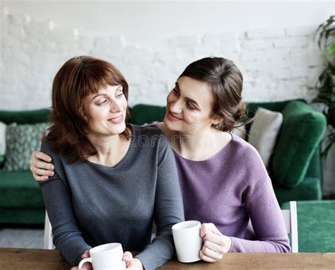 Beautiful Mature Mother And Her Adult Daughter Are Drinking Coffee Stock Image Image Of Adult