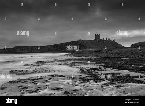 Dunstanburgh Castle sunrise, Northumberland Stock Photo - Alamy