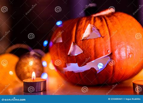 Spooky Smiling Halloween Pumpkin In Burning Fire Candles Flames Stock