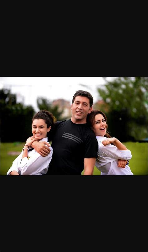 Two Women And A Man Are Posing For A Picture Together In The Park With