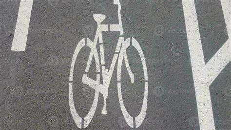 bike lane markings on black asphalt or road 8200713 Stock Photo at Vecteezy