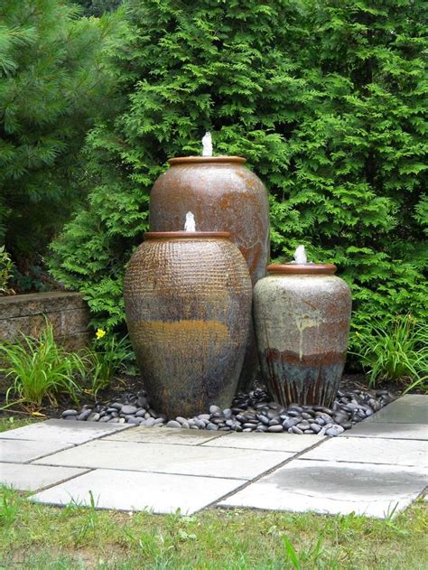 Three Urn Pottery Water Fountains With Line Details And Color Gradation