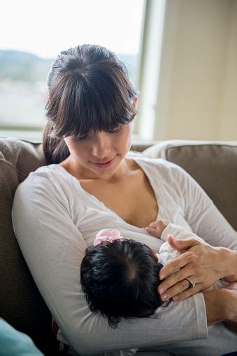 Mother Nursing Her Baby Stock Photo Download Image Now Istock