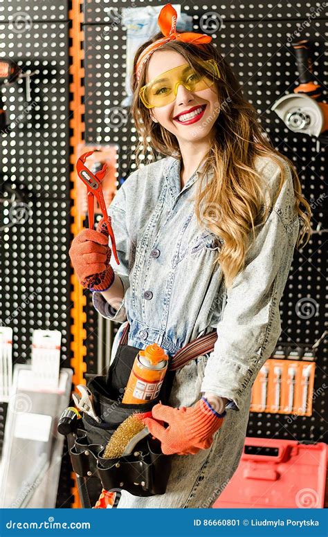 Portrait Of The Attractive Salesgirl With Long Blonde Hair And Yellow