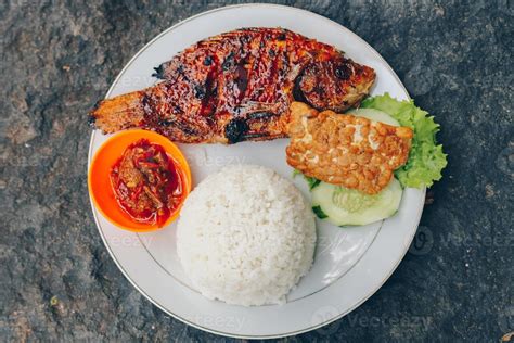 Delicious Grilled Tilapia From Indonesia With Rice Tempeh Vegetables