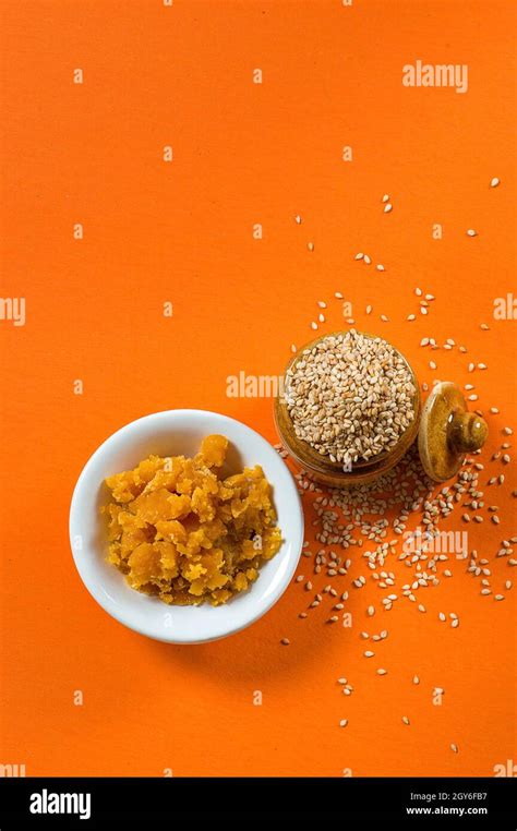 Sesame Seeds In Clay Pot With Jaggery In Bowl Stock Photo Alamy