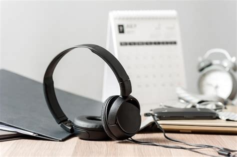 Premium Photo Wired Black Headphone Isolated On The Desktop