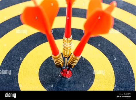 Closeup One Target With Three Dart Arrows Hitting The Bullseye Center