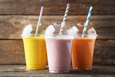 Smoothie in plastic cups stock photo. Image of cutout - 103727116