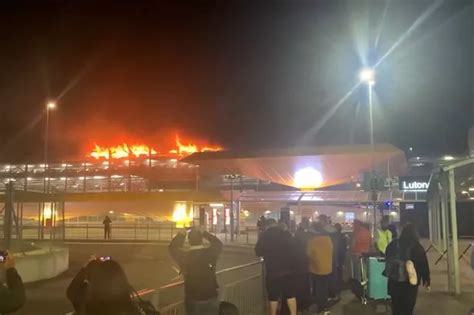 Luton Airport car park fire sees flights diverted to Stansted Airport with thousands disrupted ...