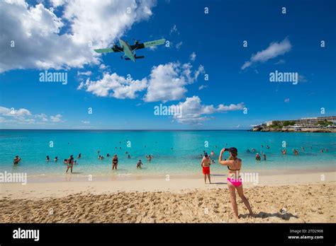 Maho Beach With People Watching At Airplane Landing On Princess Juliana