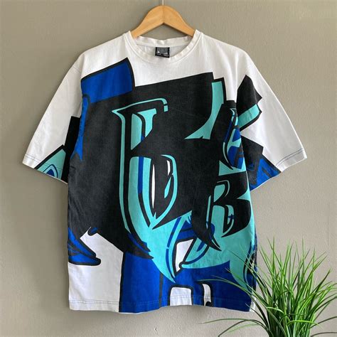 Vintage Vintage y2k Ruff Ryders Clothing all over print t-shirt! | Grailed