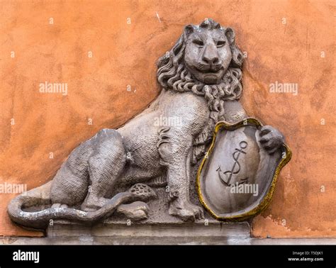 Bas Relief Of A Lion With A Shield On The Wall Stock Photo Alamy