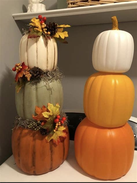 Three Pumpkins Are Stacked On Top Of Each Other