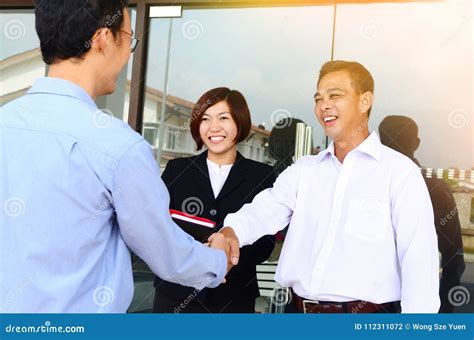 Asian Businessmen Shaking Hands Stock Photo Image Of Team Agreement