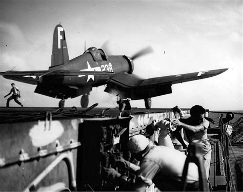 Asisbiz Vought F4U 4 Corsair VBF 83 White F238 Launches From The Flight