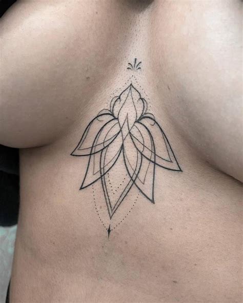 Ornamental Lotus Flower Tattoo On The Sternum