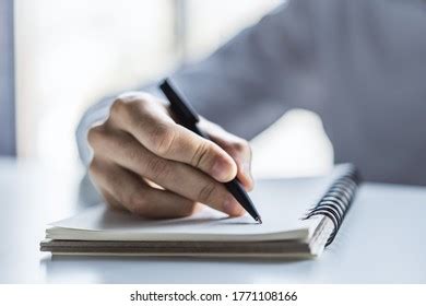 Man Writes Pen Diary Sunny Office Stock Photo 1723399210 Shutterstock