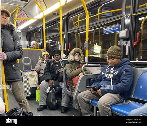 People Riding A City Bus After Work In The Evening In Brooklyn New