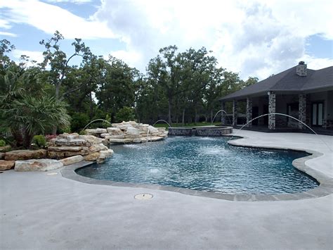 Pool and hot tub with fountains and water feature