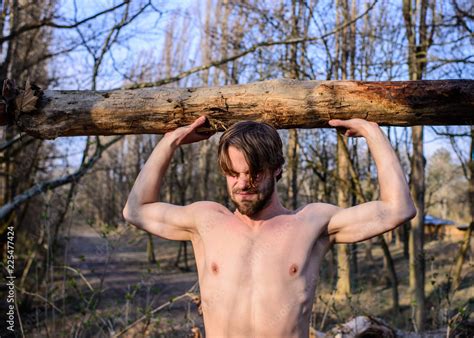 Man Brutal Strong Attractive Guy Collecting Wood In Forest Lumberjack