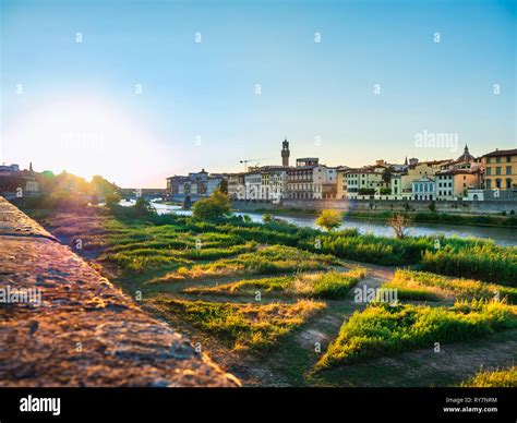 Florence sunset with river and bridge Stock Photo - Alamy