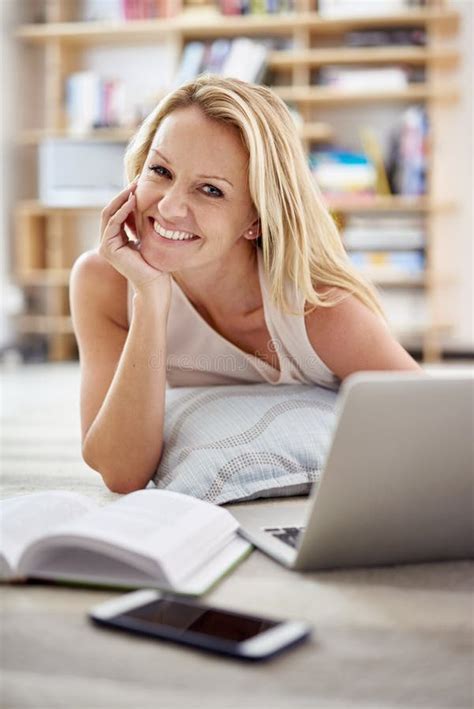 Whiling Away The Day Online Portrait Of A Beautiful Mature Woman Lying