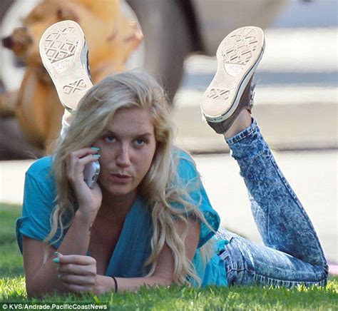 Kesha Displays Bizarre Behaviour As She Takes A Nap On The Grass Verge