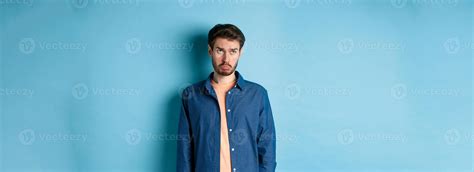 Sad Man Whining And Sulking Looking Up With Upset Face Standing On