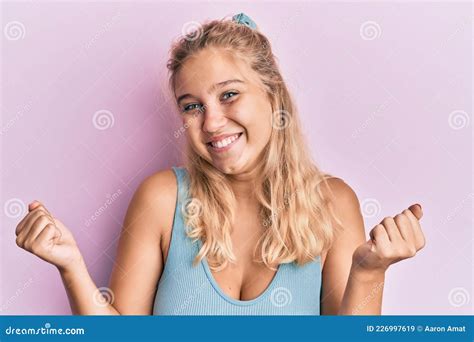 Young Blonde Girl Wearing Casual Clothes Celebrating Surprised And