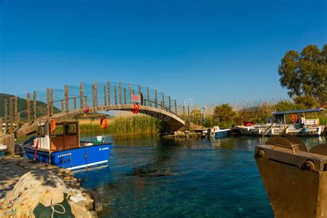 Akyaka Mugla Turkey Arched Bridge And Boats Moored At The Azmak