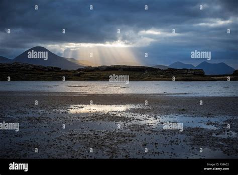 Sunlight Breaking Through Storm Clouds On The Isle Of Skye Stock Photo