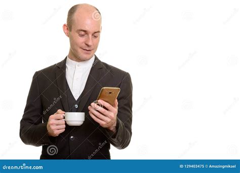 Happy Bald Caucasian Businessman Smiling While Holding Mobile Ph Stock