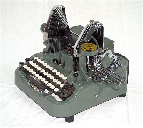 An Old Fashioned Typewriter Sitting On Top Of A White Sheet Covered