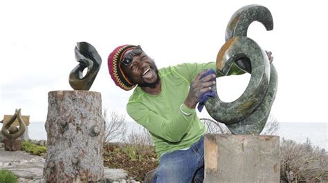 Zimbabwean stone sculptures by the lake at an Oakville home ...