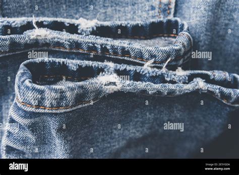 Denim Blue Jeans Texture With Scuffs And Holes Abstract Background