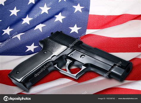 Gun On Usa Flag Stock Photo By ©stillfx 192338742