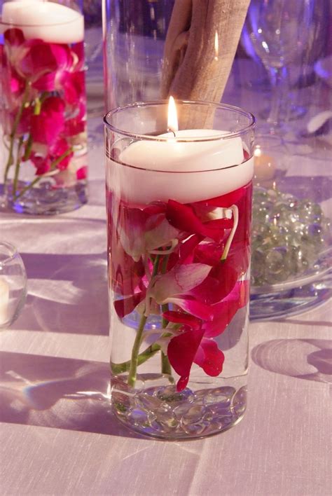 Pink Cymbidium Orchids And Floating Candle Accents Floating Candle