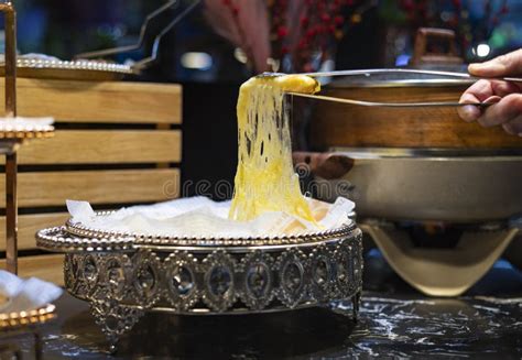 Use Tongs To Pick Up The Brushed Durian Pizza Stock Photo Image Of