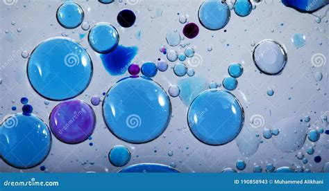 Oil Bubbles In Water The Colors Blue And Black And Purple Are Mixed