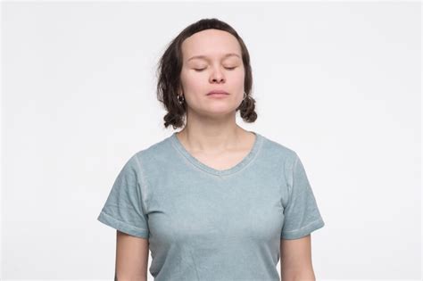 Premium Photo Young Caucasian Woman Standing With Closed Eyes Feeling