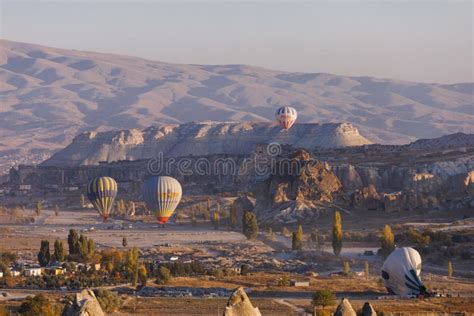 Cappadocia View Of Goreme Town With Caves And Hot Air Balloons In Cappadocia Turkey Editorial