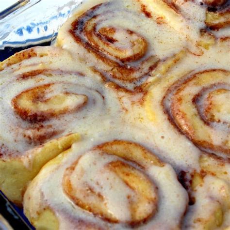 Cinnamon Rolls Sitting On Top Of A Blue Pan