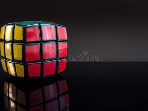 Round Rubik`s Cube On Black Background With Reflection Editorial Stock