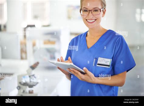 Pathology Is Her Calling A Beautiful Female Doctor Holding A Tablet